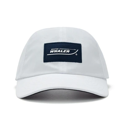 Image of a white cap with a dark blue Boston Whaler logo patch on the front