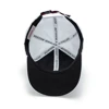 Image of a white cap with a dark blue Boston Whaler logo patch on the front