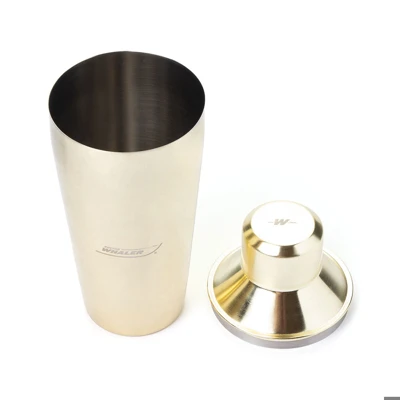 Image of a gold cocktail shaker with Boston Whaler logo on it