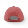 Back view of a coral washed baseball cap with an adjustable strap and stitched eyelets.