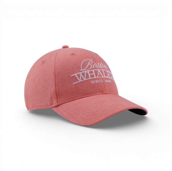 Coral washed baseball cap shown from a side angle with a curved bill and white embroidered “Boston Whaler Since 1958” logo.