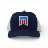 Navy mesh‑back hat with a white mesh rear panel and a red, white, and blue shield-style patch on the front.