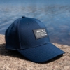 Boston Whaler Channel Hat pictured in front of water
