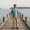 Man standing on dock wearing Boston Whaler Performance Shirt